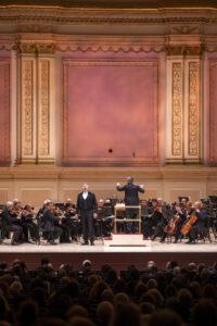 Christmas Night Opera with Francesco Lanzillota conducting the American Symphony Orchestra with Anita Monserrat, Asmik Grigorian, Brian Jagde, Nadine Sierra, Sondra Radvanovsky, Thomas Hampson performing at Carnegie Hall. Photo: Chris Lee